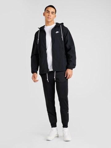 juoda Nike Sportswear Demisezoninė striukė