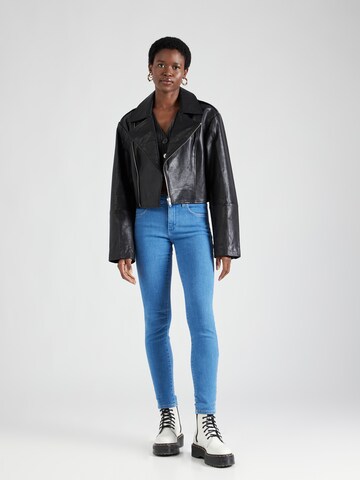 WRANGLER Скинни Джинсы в Синий