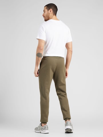 Tapered Pantaloni 'Classic Core' di new balance in verde