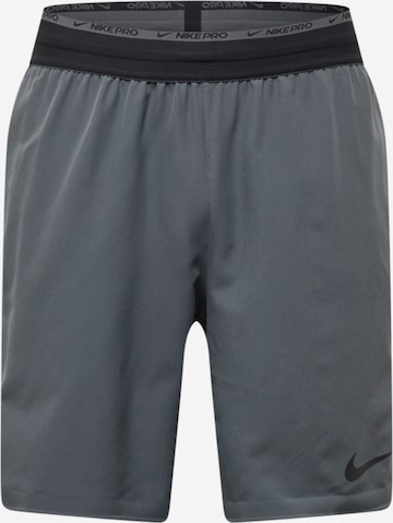 NIKE Sports trousers in Grey: front