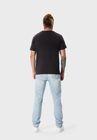 Oldskull T-Shirt 'Wrldvibe Travel' in Schwarz