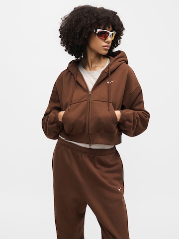 ruda Nike Sportswear Siaurėjantis Kelnės 'Studio Fleece'