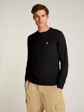 Pull-over Calvin Klein Jeans en noir : devant