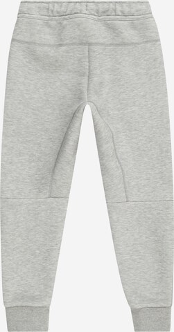 Tapered Pantaloni di Nike Sportswear in grigio