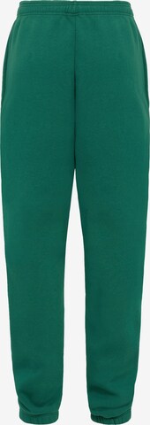 UNFOLLOWED x ABOUT YOU Zwężany krój Spodnie 'BOLD' w kolorze zielony: tył