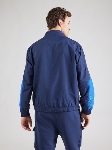 Nike SportswearPrijelazna jakna 'AIR' - plava boja