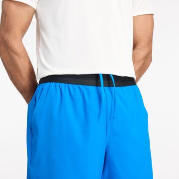 Skinny Pantalon de sport new balance en bleu