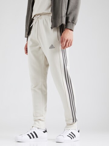 ADIDAS SPORTSWEAR - Tapered Calças de desporto em bege: frente