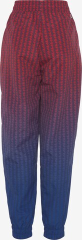 LACOSTE Tapered Workout Pants in Red: front