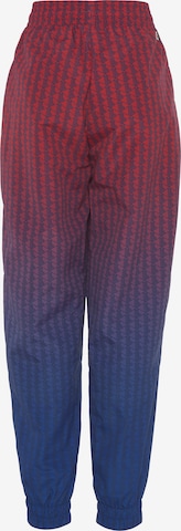 LACOSTE Tapered Workout Pants in Red: front