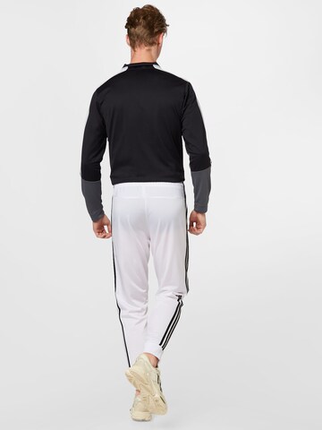 ADIDAS SPORTSWEAR Tapered Sports trousers 'Essentials Warm-Up' in White
