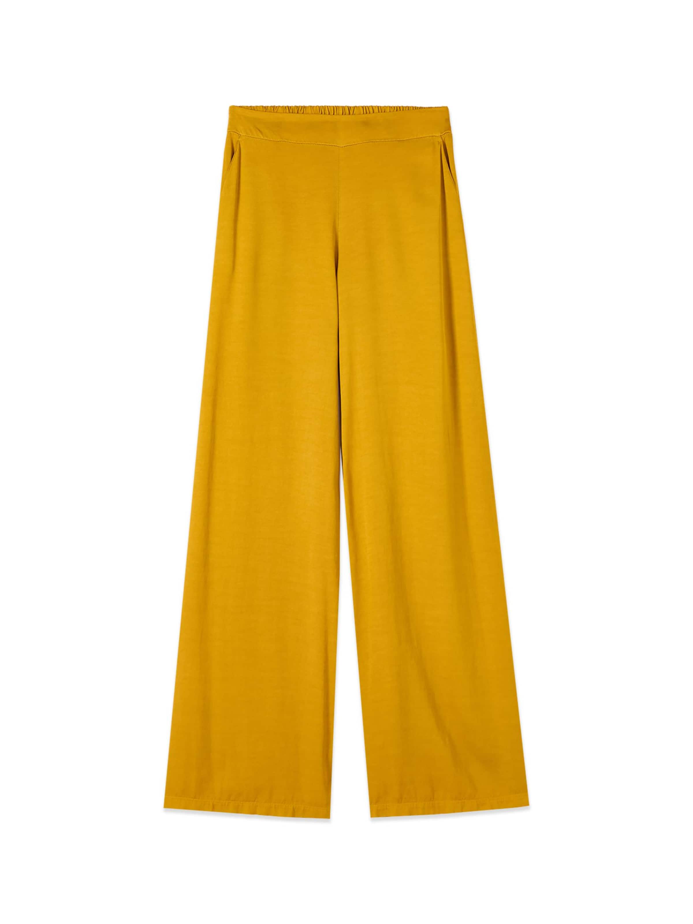 oltre Baggy Trousers in Yellow: front
