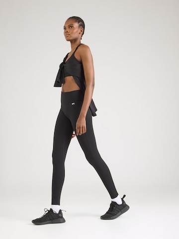 UNDER ARMOUR Skinny Sportnadrágok 'Motion' - fekete