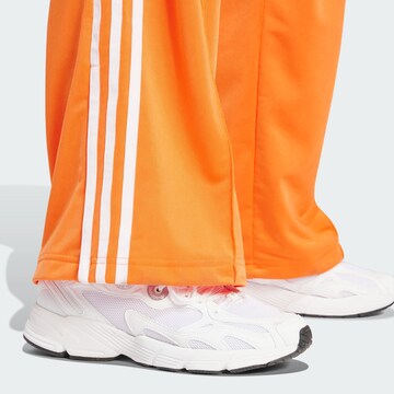 ADIDAS ORIGINALS Wide leg Broek 'Firebird' in Oranje