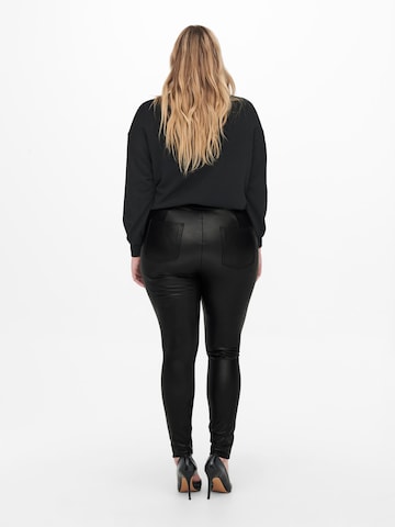 ONLY Carmakoma Skinny Leggingsit 'Simone' värissä musta