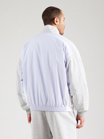 Nike Sportswear Overgangsjakke 'CLUB' i blå