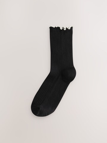 Next Sockor i svart