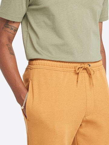 Tapered Pantaloni di TIMBERLAND in giallo