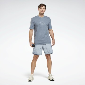 Reebok T-Shirt 'Les Mills®' in Blau: predná strana