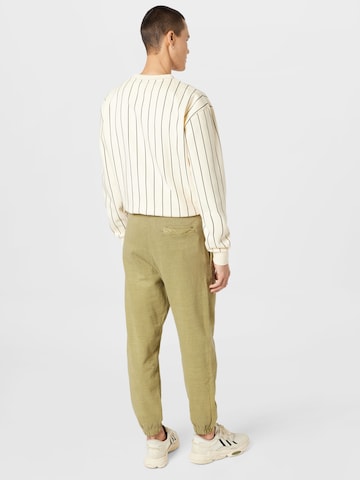 Tapered Pantaloni di Karl Kani in verde