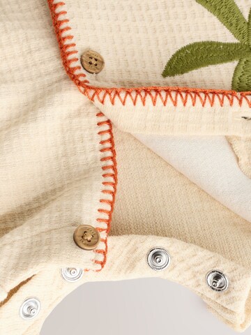 Tutina / body per bambino di Next in beige