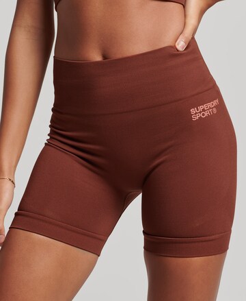 Superdry Skinny Workout Pants in Red: front