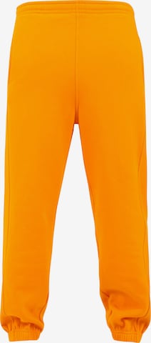 Pantaloni di Urban Classics in arancione: frontale