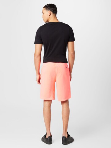 Champion Authentic Athletic Apparel Regular Trousers in Orange