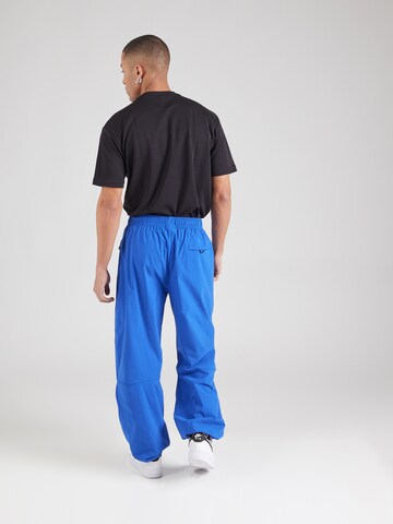 Nike Sportswear Tapered Nadrág 'Tech' - kék