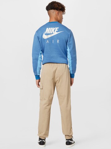 Nike Sportswear Tapered Trousers in Beige