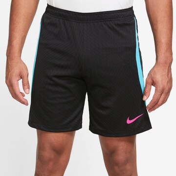 NIKE Loose fit Sports trousers 'Strike' in Black: front