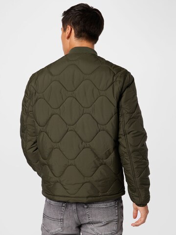 Veste mi-saison Tommy Jeans en vert