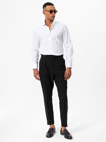 Tapered Pantaloni con pieghe di Antioch in nero