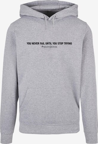 Merchcode Sweatshirt 'Never Give Up' in Grau: predná strana