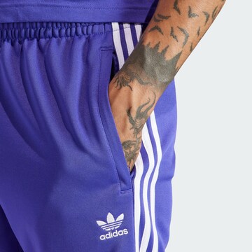 ADIDAS ORIGINALS Zwężany krój Spodnie 'Adicolor Classics SST' w kolorze niebieski