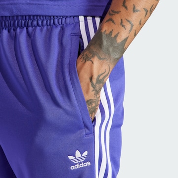 ADIDAS ORIGINALS - Tapered Pantalón 'Adicolor Classics SST' en azul