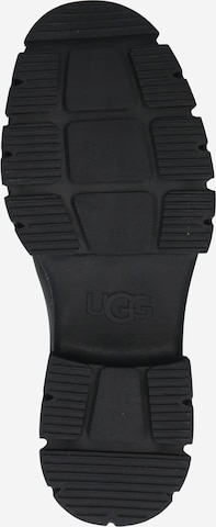 UGG حذاء تشيلسي بلون أسود