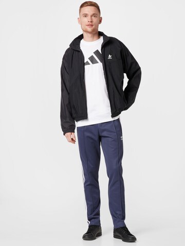 ADIDAS ORIGINALS Übergangsjacke in Schwarz