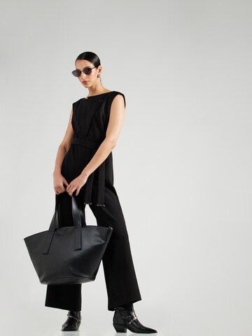 Tuta jumpsuit di DKNY in nero