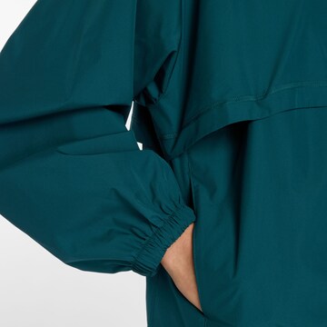 Veste de sport 'Trackside Woven Jacket' new balance en vert