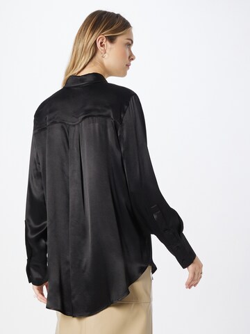 Warehouse - Blusa en negro