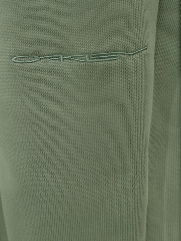 OAKLEY Zwężany krój Spodnie sportowe 'SOHO' w kolorze zielony