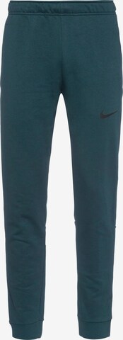 NIKE Workout Pants in Blue: front