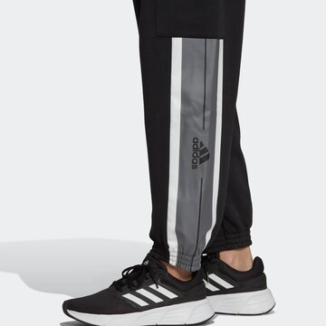 ADIDAS SPORTSWEAR Loose fit Sports trousers 'Essentials Pin Stripe Block Fleece ' in Black