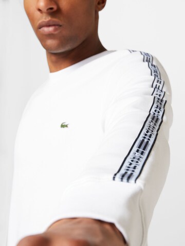 LACOSTE Sweatshirt i vit