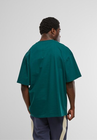 Karl Kani T-Shirt 'Essential' in Grün