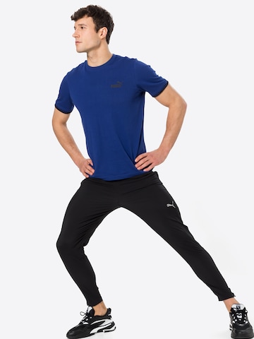 PUMA Tapered Sportbroek in Zwart