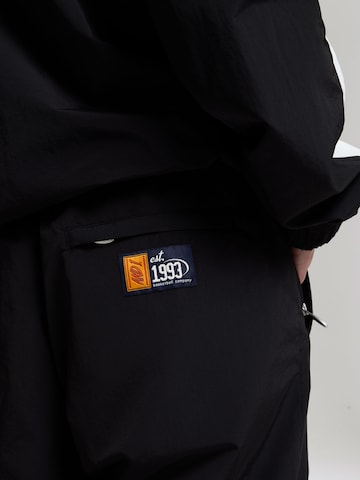 Effilé Pantalon AND1 en noir