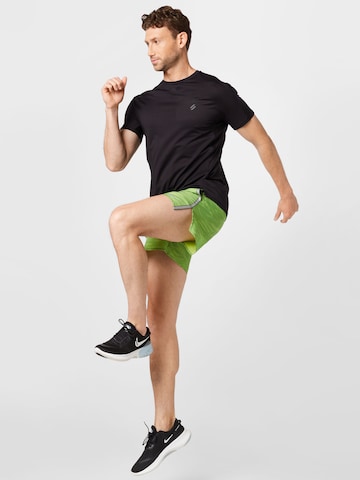 Regular Pantaloni sport 'Move to Zero' de la NIKE pe verde