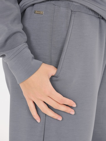 Athlecia - Tapered Pantalón deportivo 'Jacey' en gris